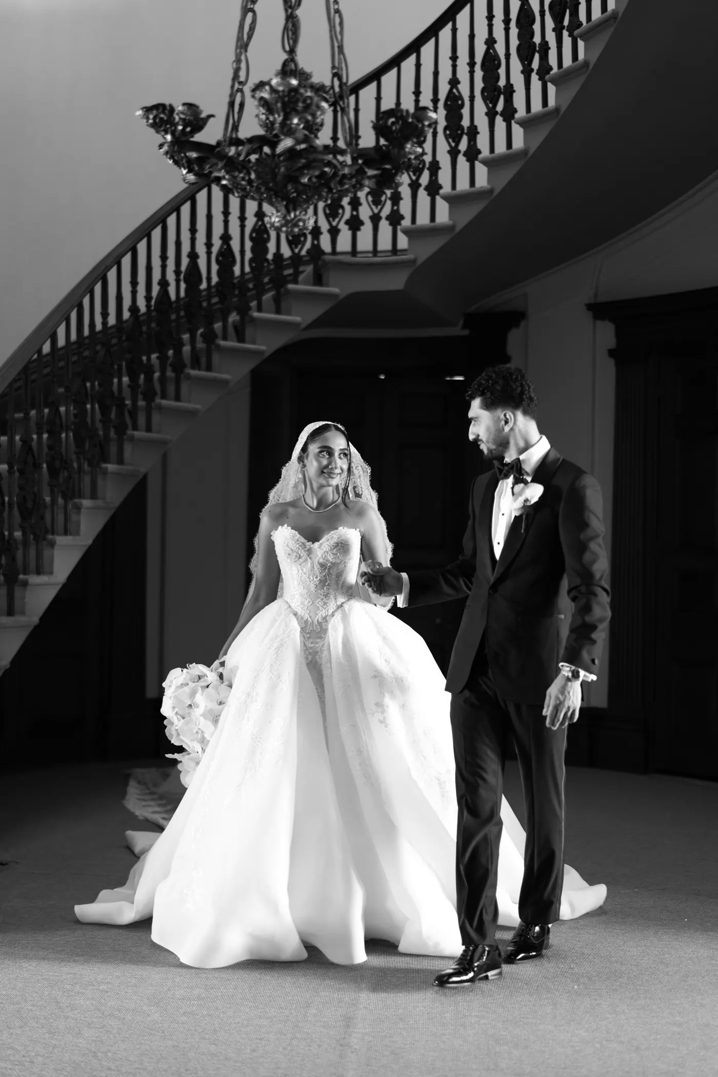 Couple beneath a staircase