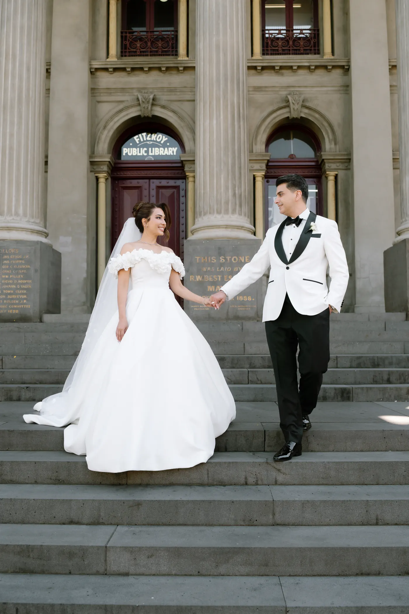 Couple on a grand staircase