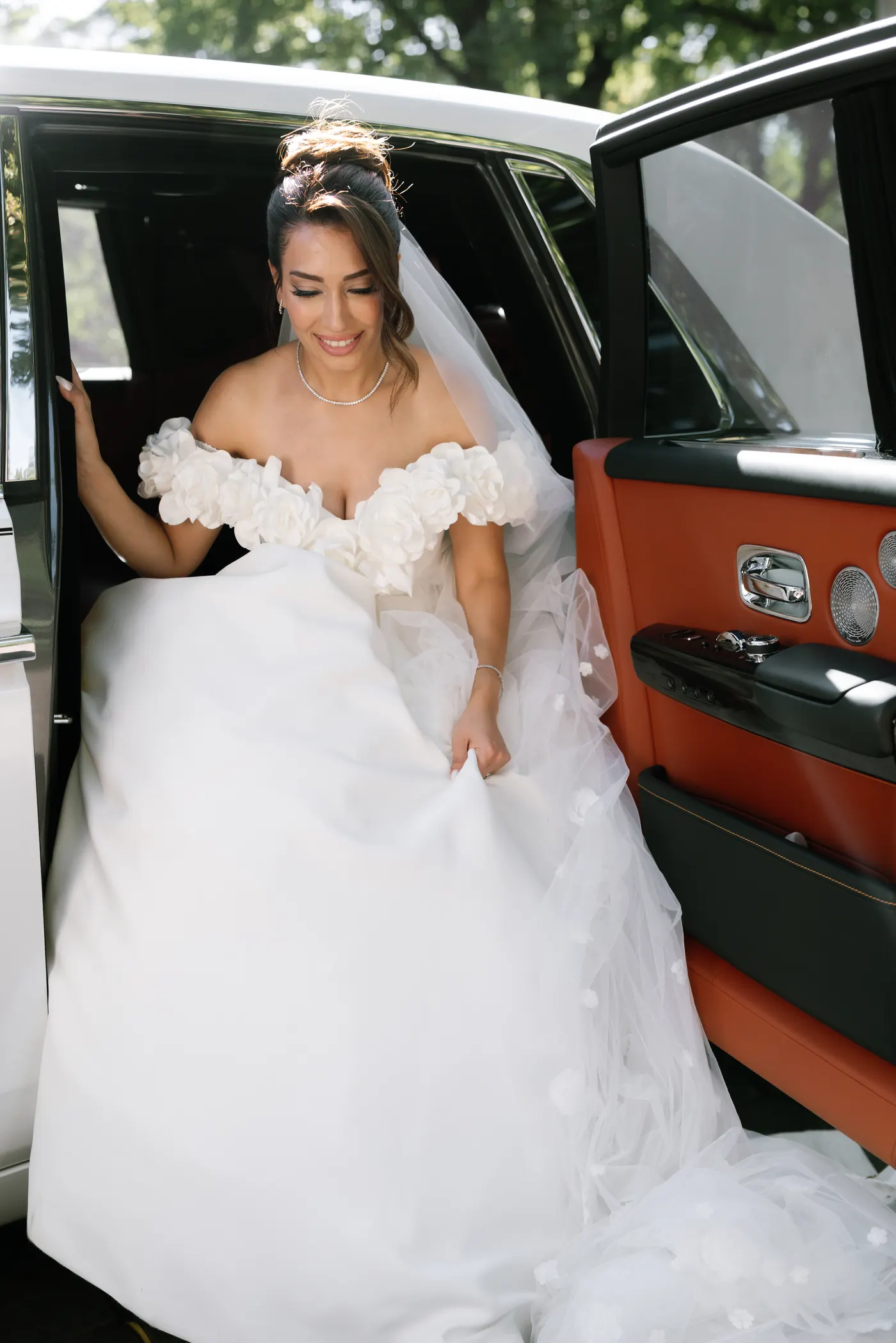 Bride stepping out of a classic car